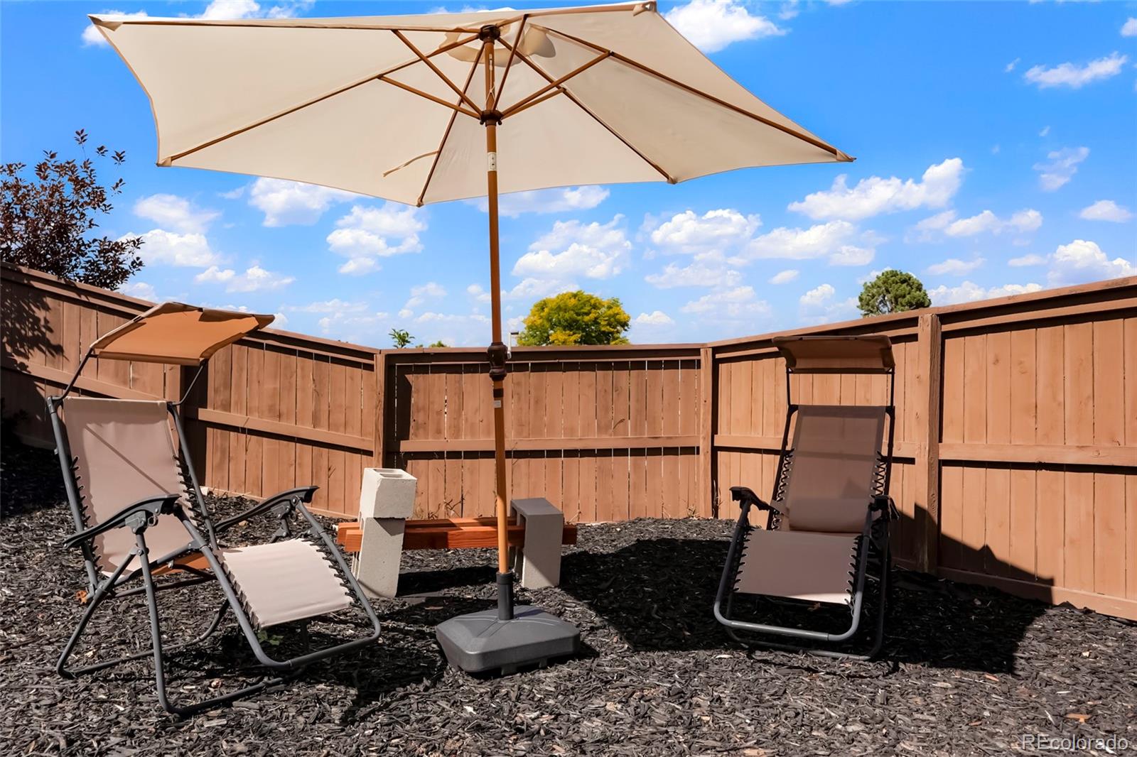 9191 Hickory Circle Highlands Ranch, CO 80126 - Photo 26 of 27 a view of a chairs and table in the patio