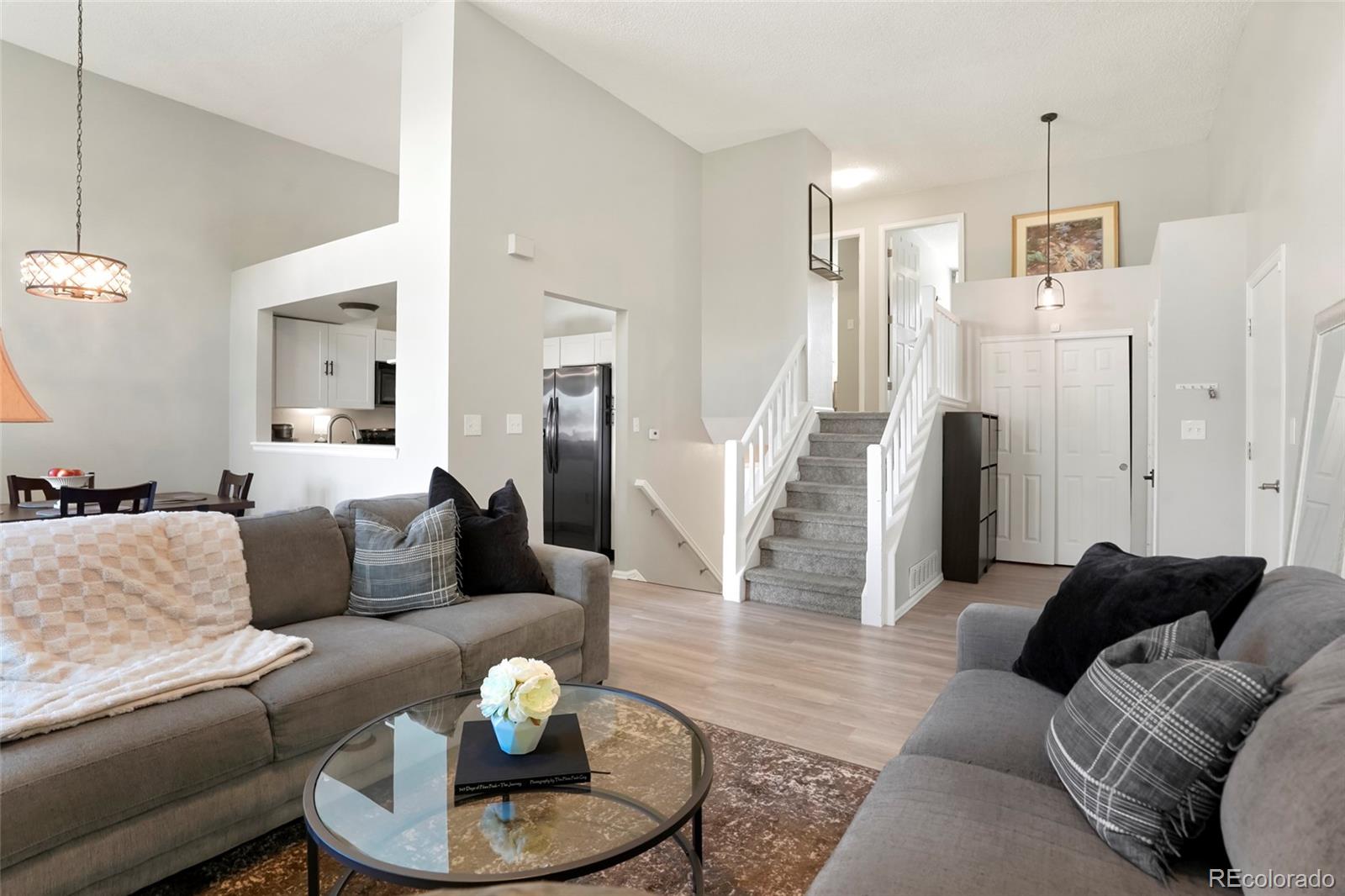 9191 Hickory Circle Highlands Ranch, CO 80126 - Photo 6 of 27 a living room with furniture and a wooden floor