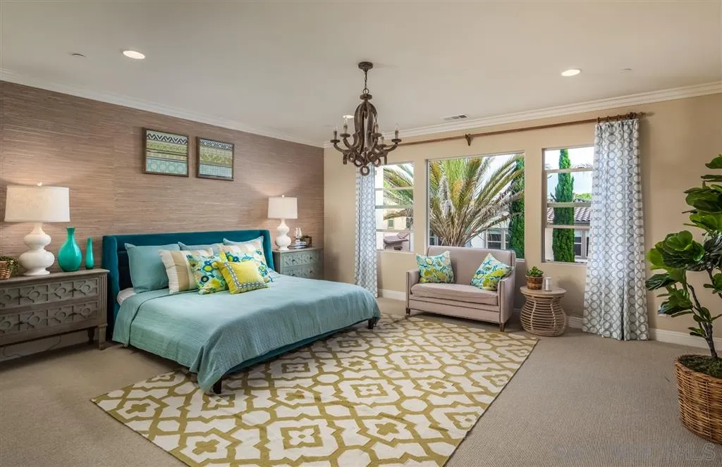 757 Blossom Road Encinitas, CA 92024 - Photo 12 of 25 a bedroom with a bed and a chandelier
