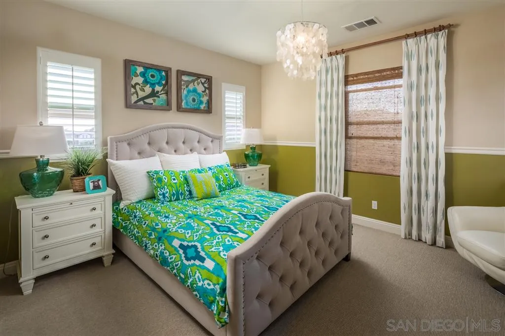 757 Blossom Road Encinitas, CA 92024 - Photo 14 of 25 a bed room with a bed and a couch