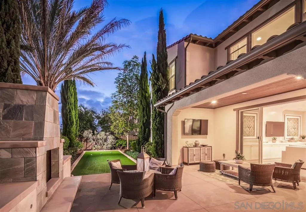 757 Blossom Road Encinitas, CA 92024 - Photo 23 of 25 a view of a patio with couches table and chairs and potted plants