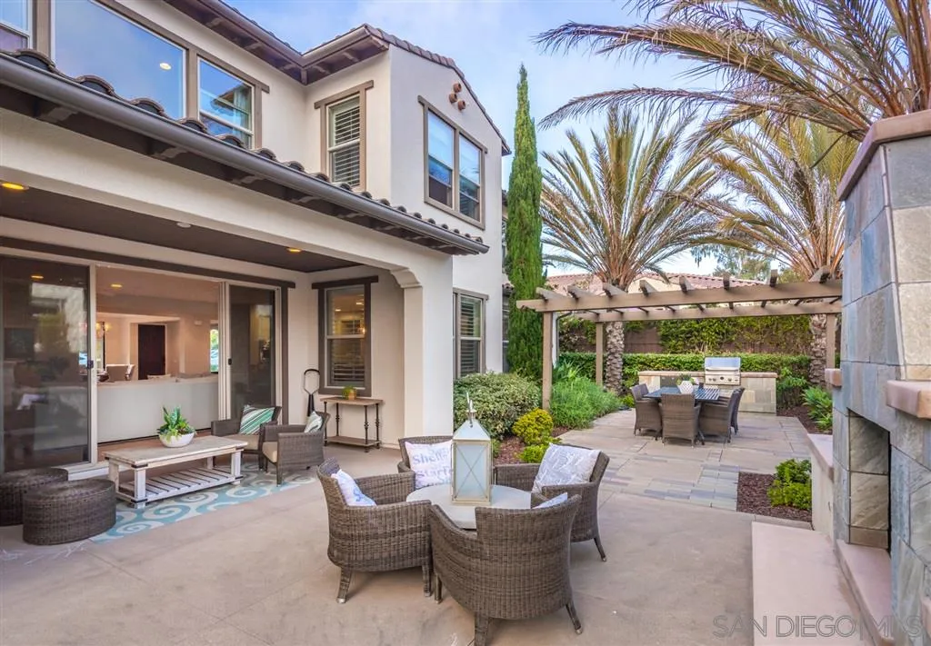 757 Blossom Road Encinitas, CA 92024 - Photo 25 of 25 a view of a patio with couches table and chairs and potted plants