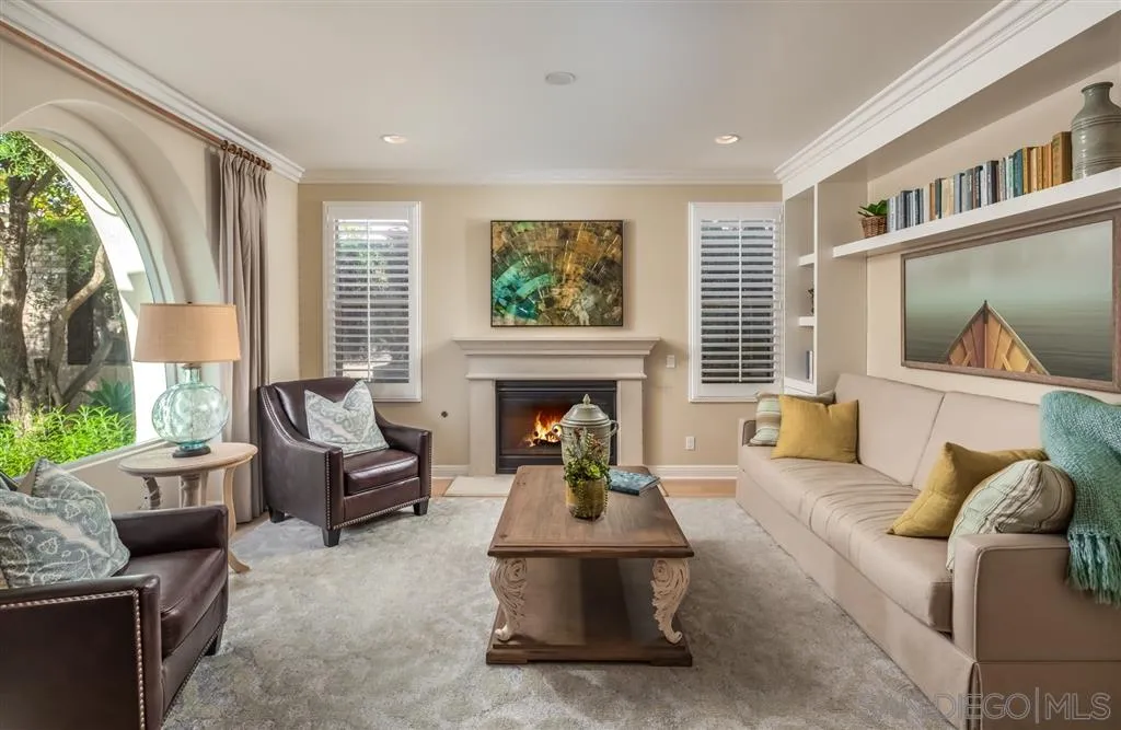 757 Blossom Road Encinitas, CA 92024 - Photo 5 of 25 a living room with furniture and a fireplace