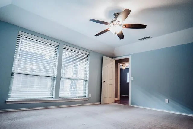 a view of an empty room with a window