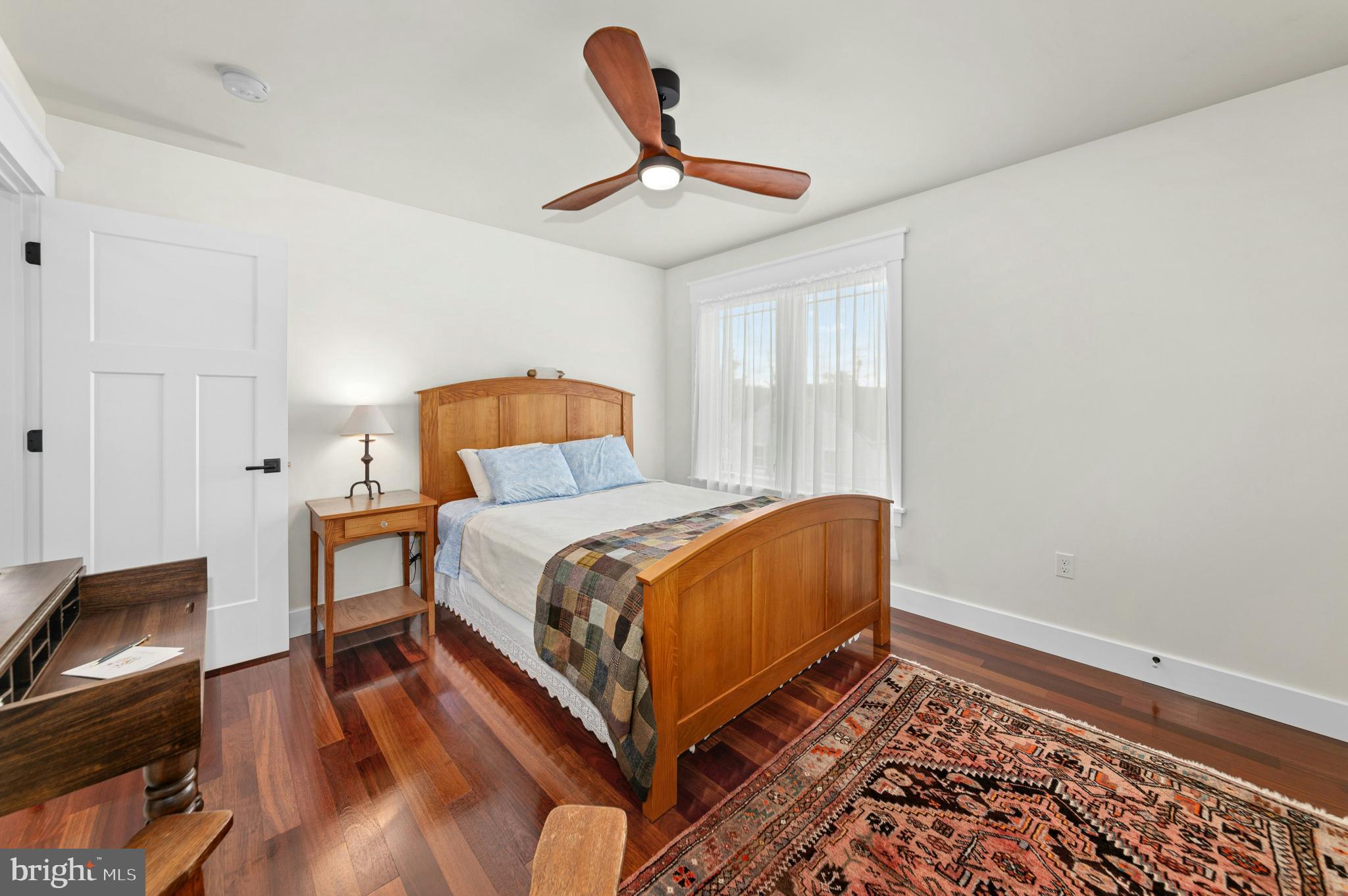 1235 River Road Upper Black Eddy, PA 18972 - Photo 28 of 41 a bedroom with a bed and wooden floor