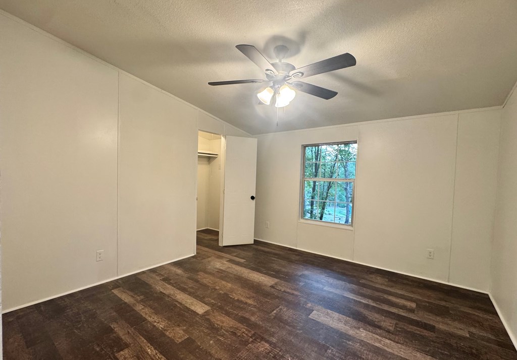 459 Vandora Suits Road Murphy, NC 28906 - Photo 29 of 40 a view of an empty room with wooden floor and a window