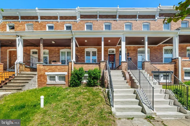 front view of a building with a yard