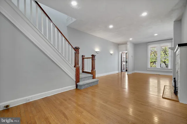 a view of an entryway with wooden floor