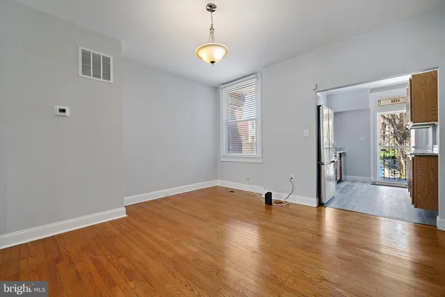 a view of livingroom with hardwood floor and a ceiling fan