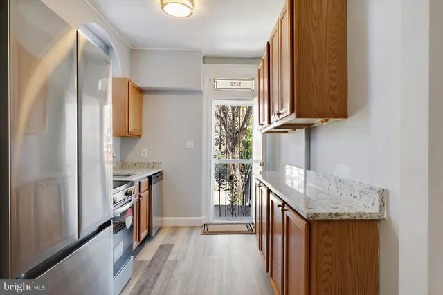 a view of hallway with wooden floor