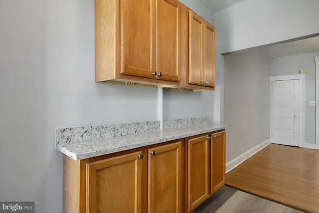 a kitchen with stainless steel appliances granite countertop a sink and cabinets