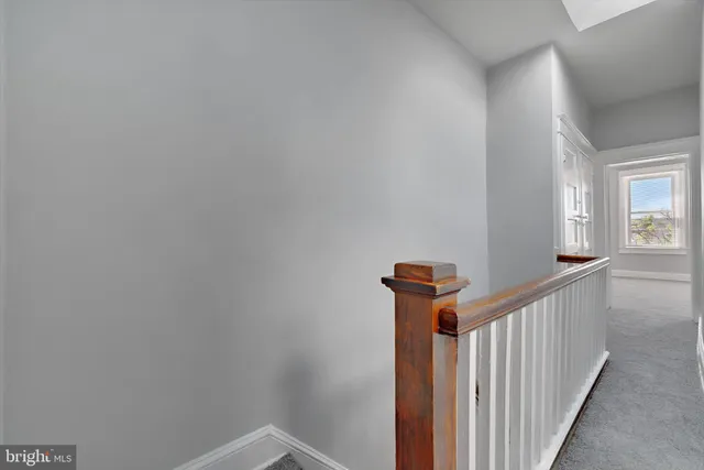 a view of a hallway with a window