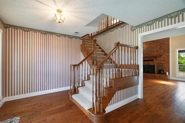 a view of a hallway with staircase