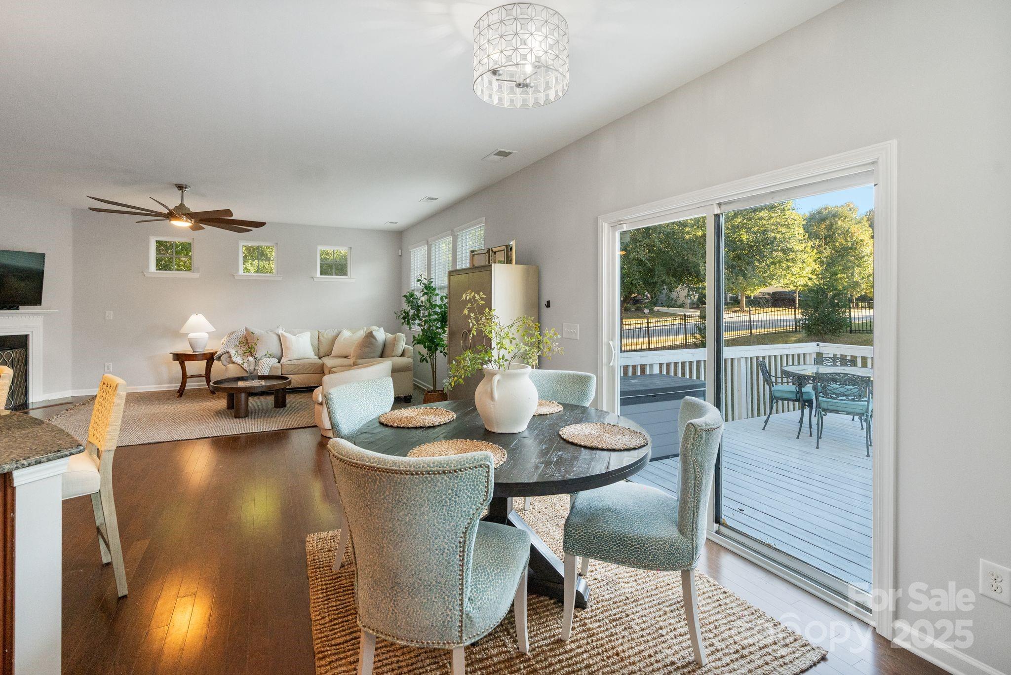2005 Brightflower Lane York, SC 29745 - Photo 15 of 48 a dining room with furniture a chandelier and wooden floor