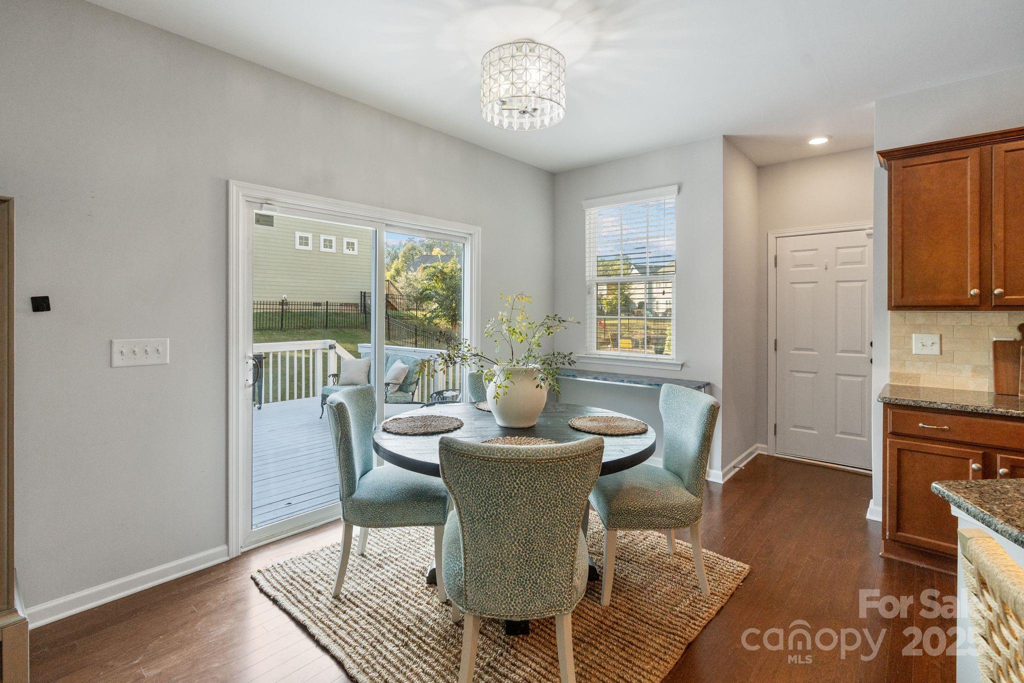 2005 Brightflower Lane York, SC 29745 - Photo 16 of 48 a dining room with furniture a window and wooden floor