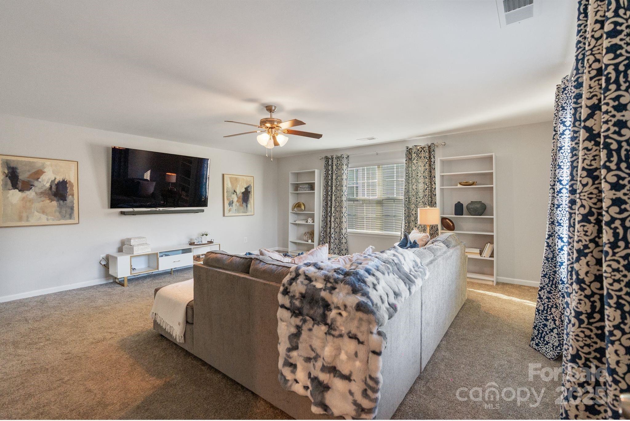 2005 Brightflower Lane York, SC 29745 - Photo 27 of 48 a living room with furniture and a flat screen tv
