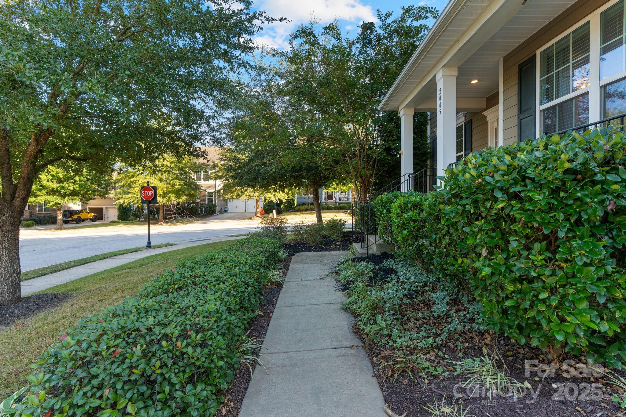 2005 Brightflower Lane York, SC 29745 - Photo 3 of 48 a view of a pathway with a building in the background