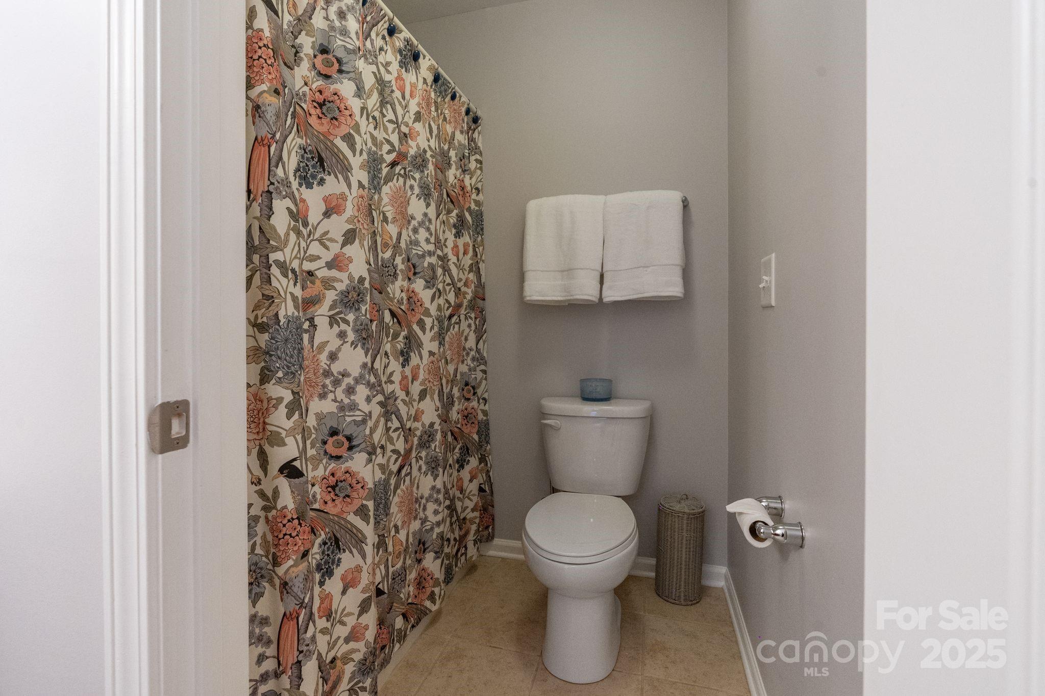 2005 Brightflower Lane York, SC 29745 - Photo 39 of 48 a white toilet sitting next to a shower curtain