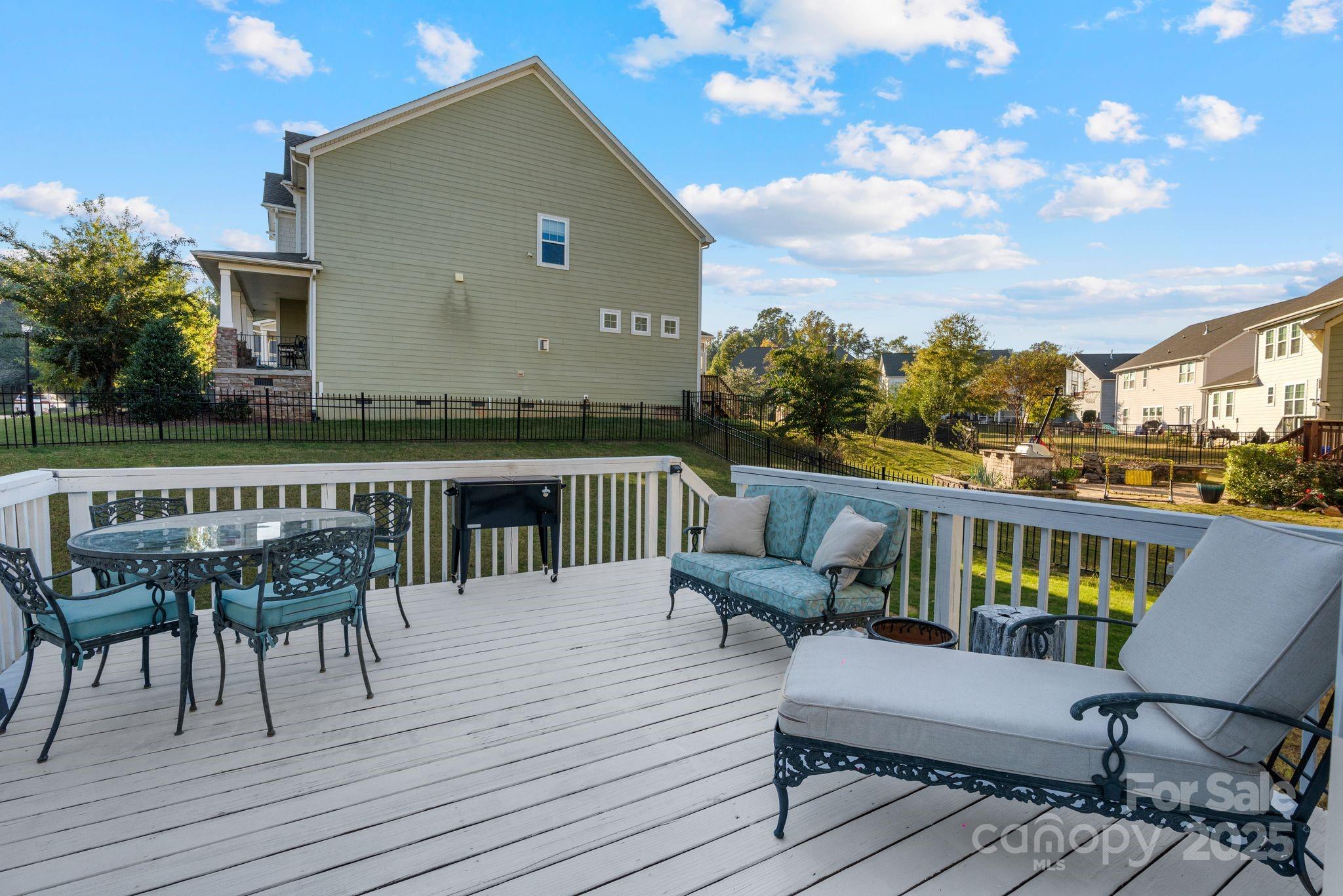 2005 Brightflower Lane York, SC 29745 - Photo 45 of 48 a balcony with wooden floor table and chairs
