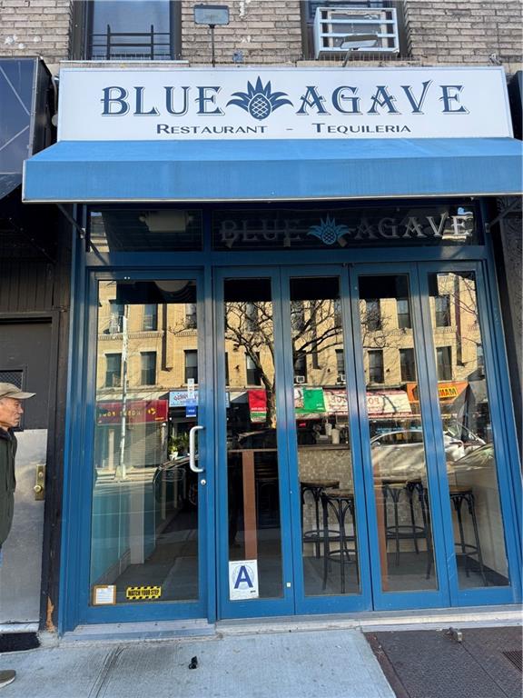 7215 3rd Avenue Brooklyn, NY 11209 - Photo 2 of 10 a front view of a retail shop and window