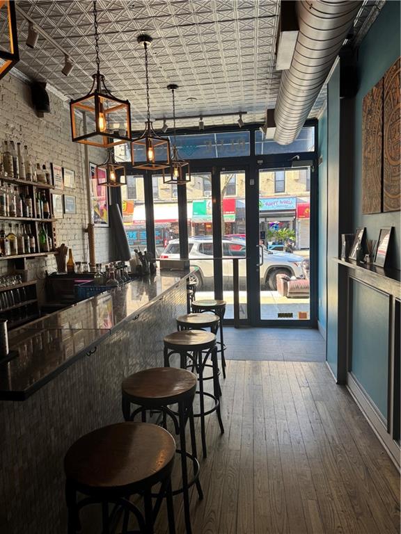 7215 3rd Avenue Brooklyn, NY 11209 - Photo 3 of 10 a view of a dining room with furniture window and wooden floor