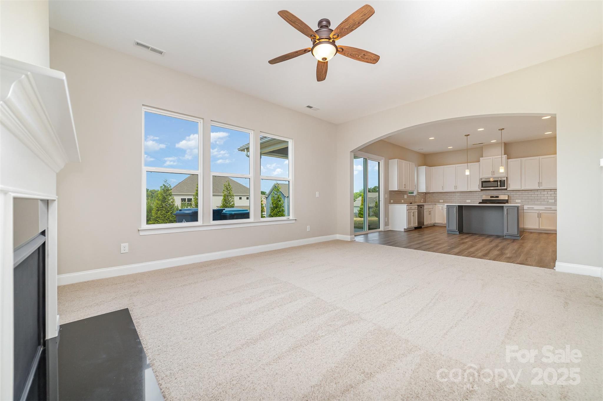 10024 Fox Trotter Lane Midland, NC 28107 - Photo 12 of 43 a view of kitchen with furniture and a ceiling fan