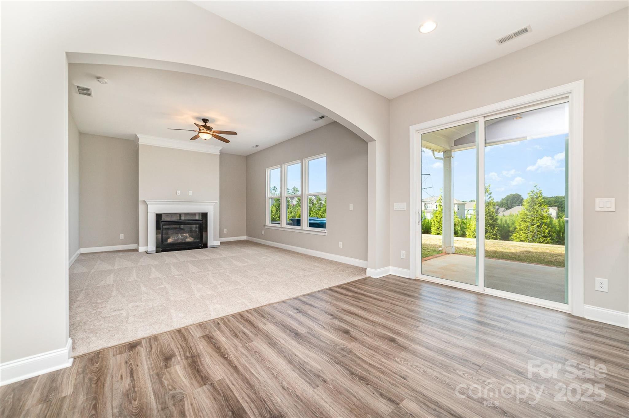 10024 Fox Trotter Lane Midland, NC 28107 - Photo 13 of 43 a view of an empty room with wooden floor and a window