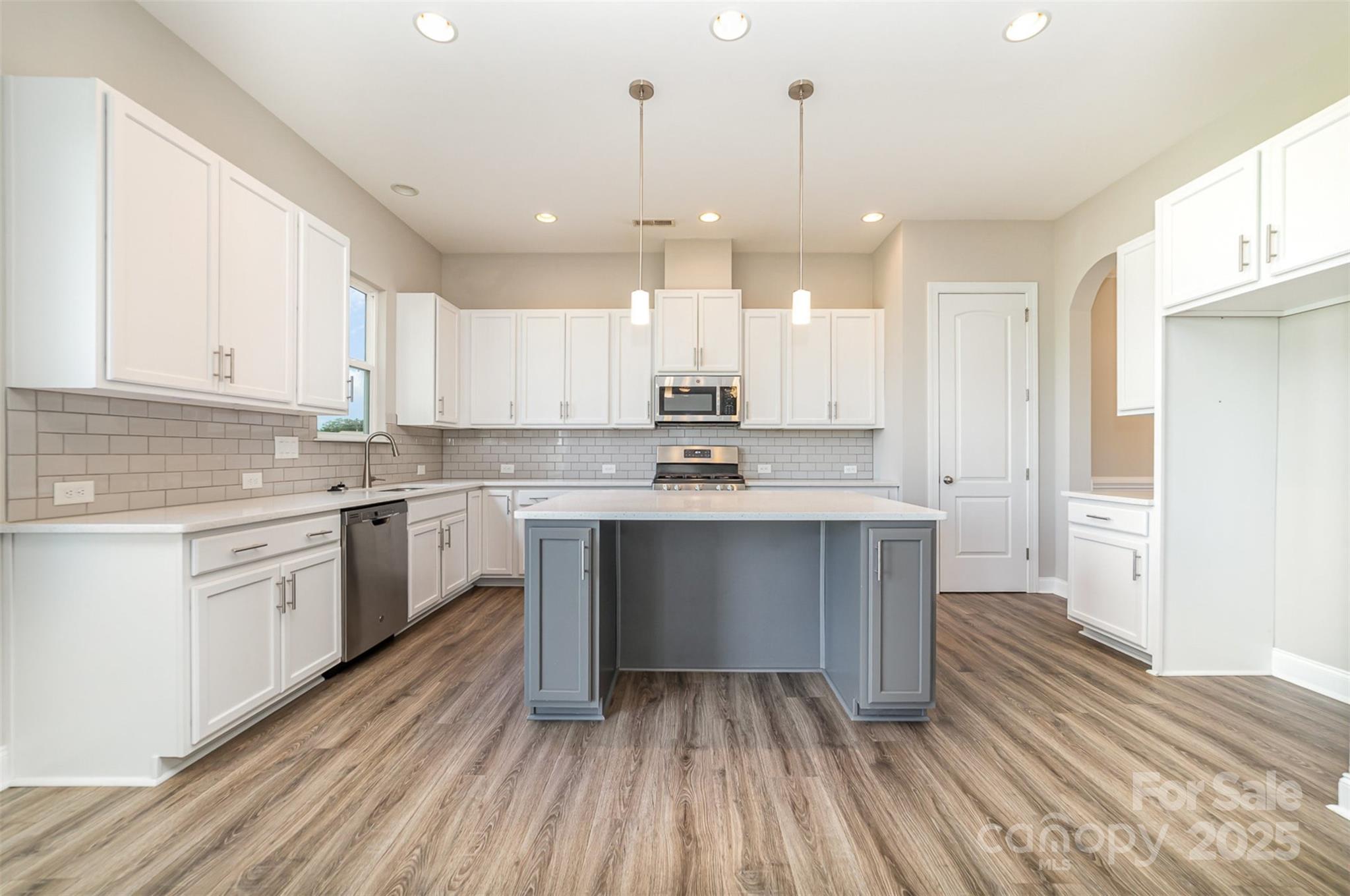 10024 Fox Trotter Lane Midland, NC 28107 - Photo 17 of 43 a kitchen with a refrigerator sink and cabinets