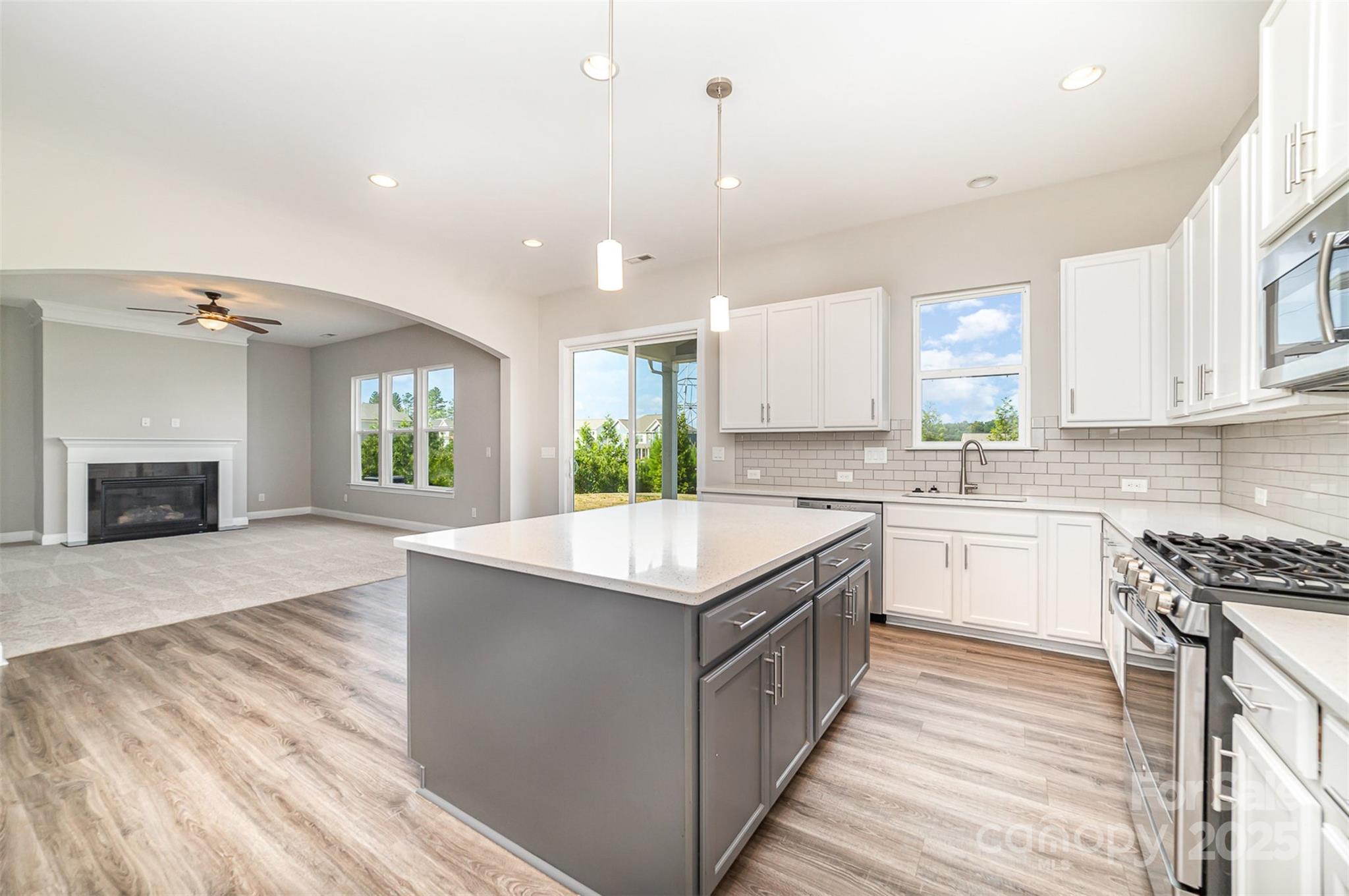 10024 Fox Trotter Lane Midland, NC 28107 - Photo 20 of 43 a kitchen with a stove sink and a microwave
