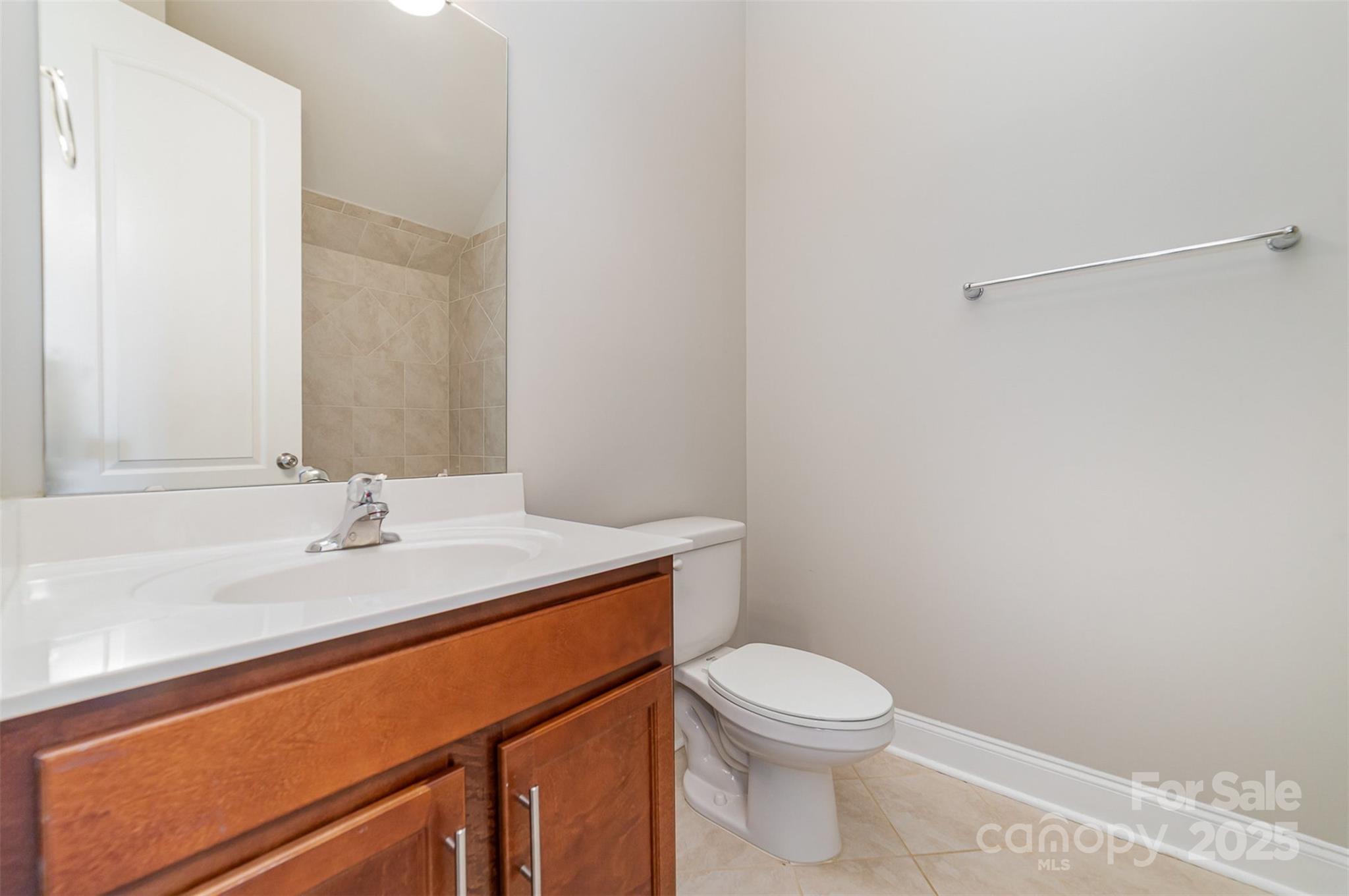 10024 Fox Trotter Lane Midland, NC 28107 - Photo 21 of 43 a bathroom with a sink a toilet and a mirror