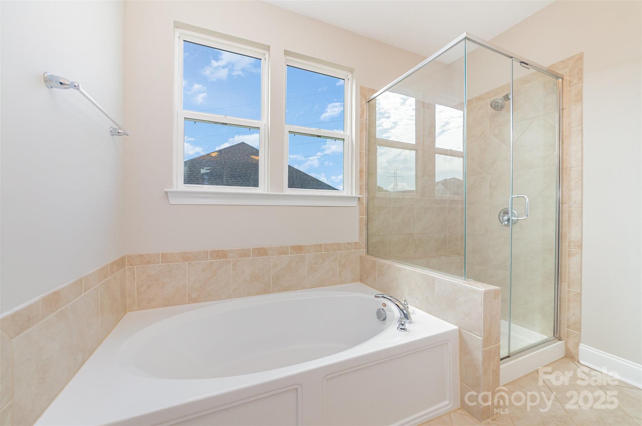10024 Fox Trotter Lane Midland, NC 28107 - Photo 27 of 43 a white bath tub sitting next to a window