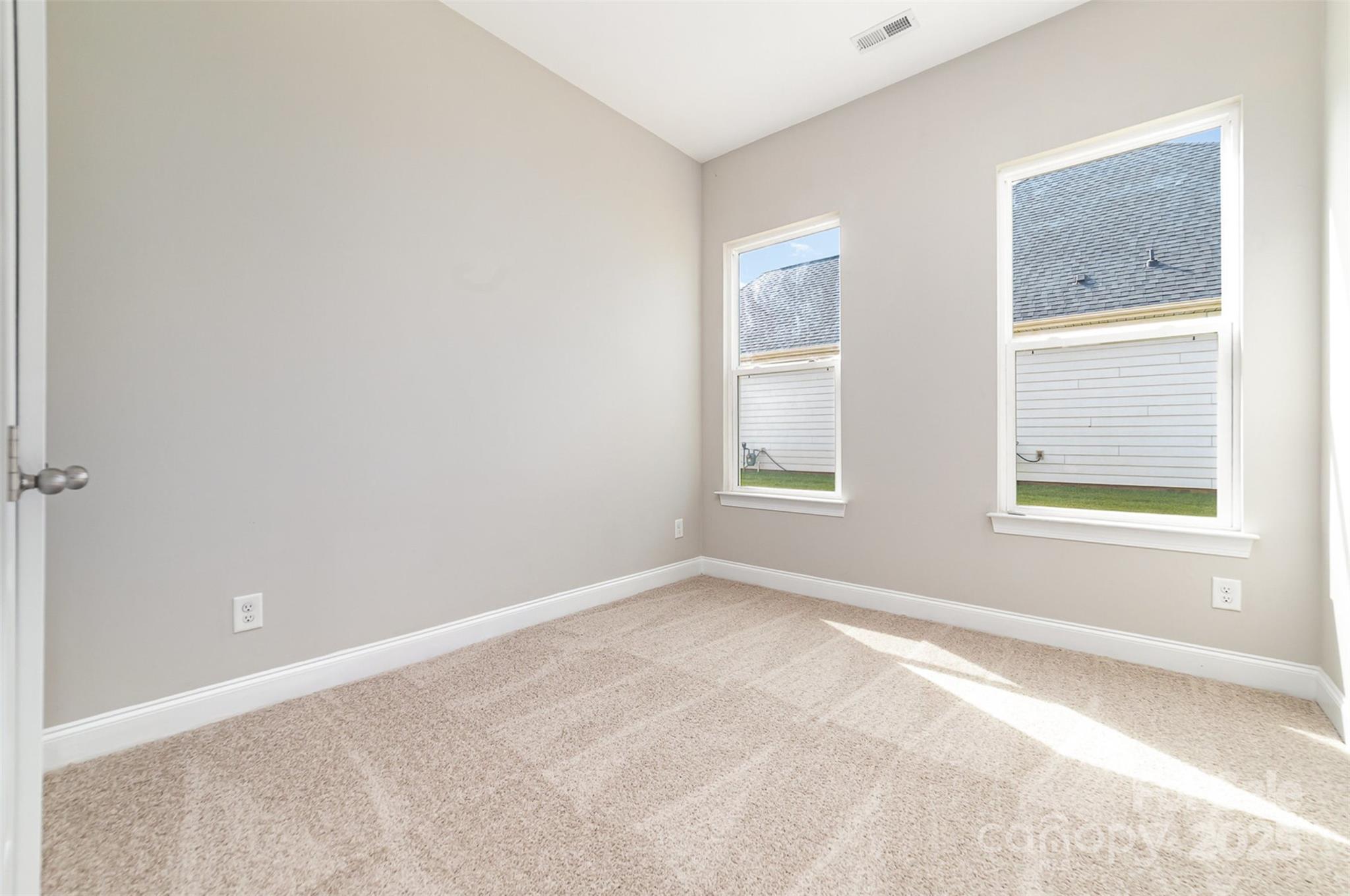 10024 Fox Trotter Lane Midland, NC 28107 - Photo 32 of 43 an empty room with windows