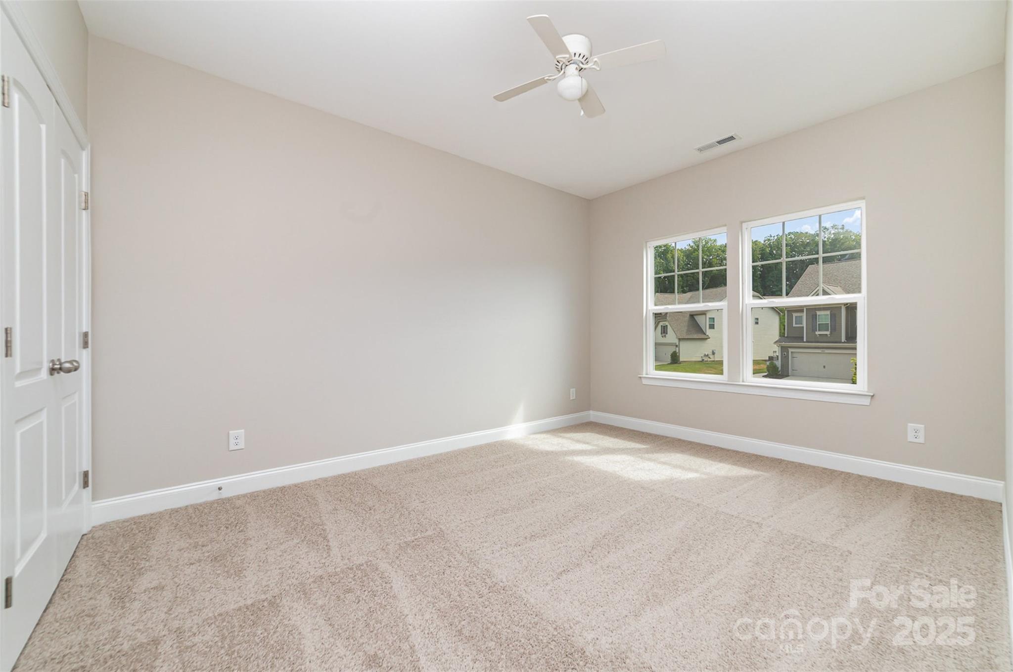 10024 Fox Trotter Lane Midland, NC 28107 - Photo 33 of 43 an empty room with windows and closet