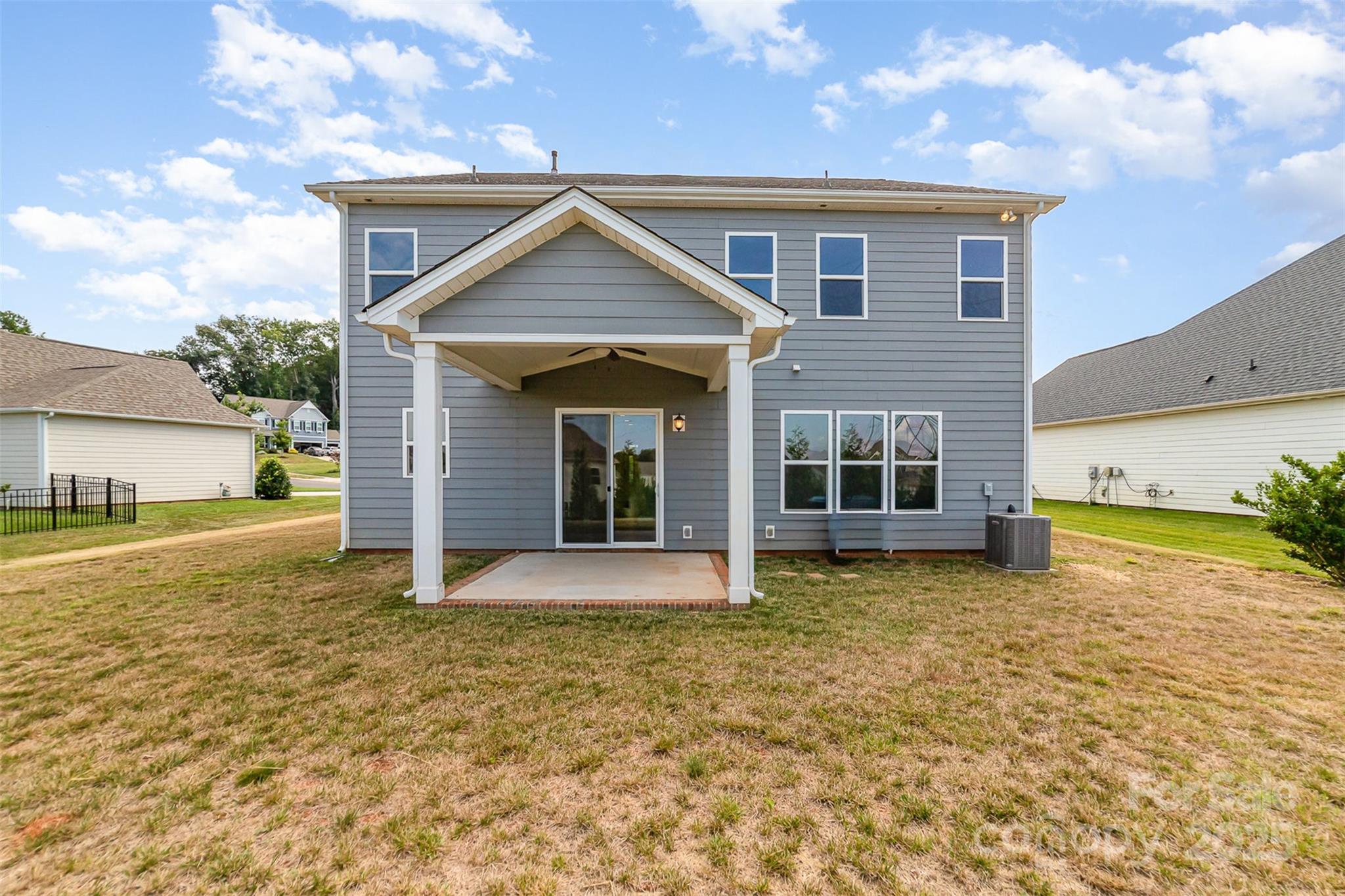 10024 Fox Trotter Lane Midland, NC 28107 - Photo 40 of 43 a front view of a house with a yard and garage