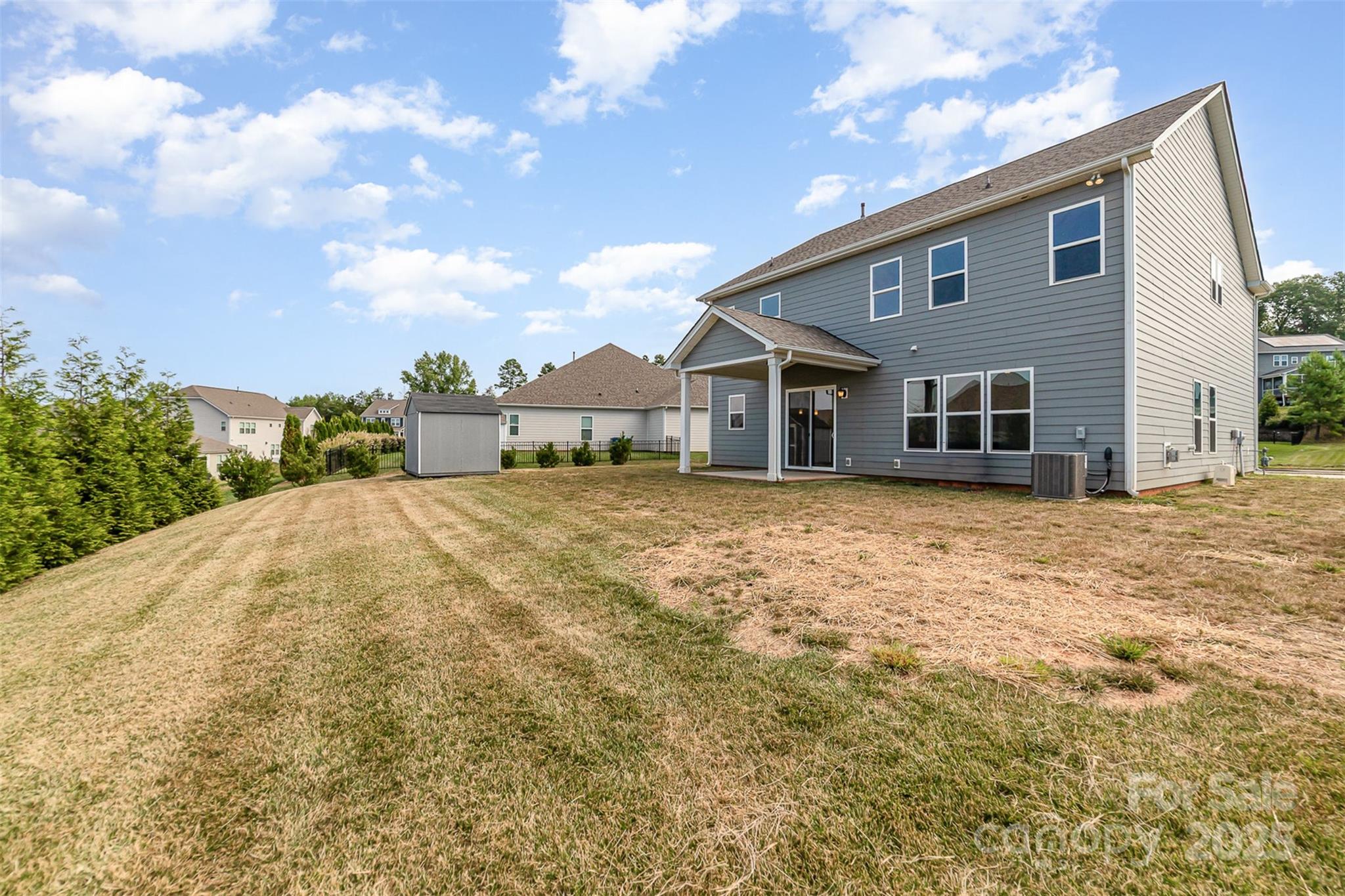 10024 Fox Trotter Lane Midland, NC 28107 - Photo 41 of 43 a front view of a house with a garden
