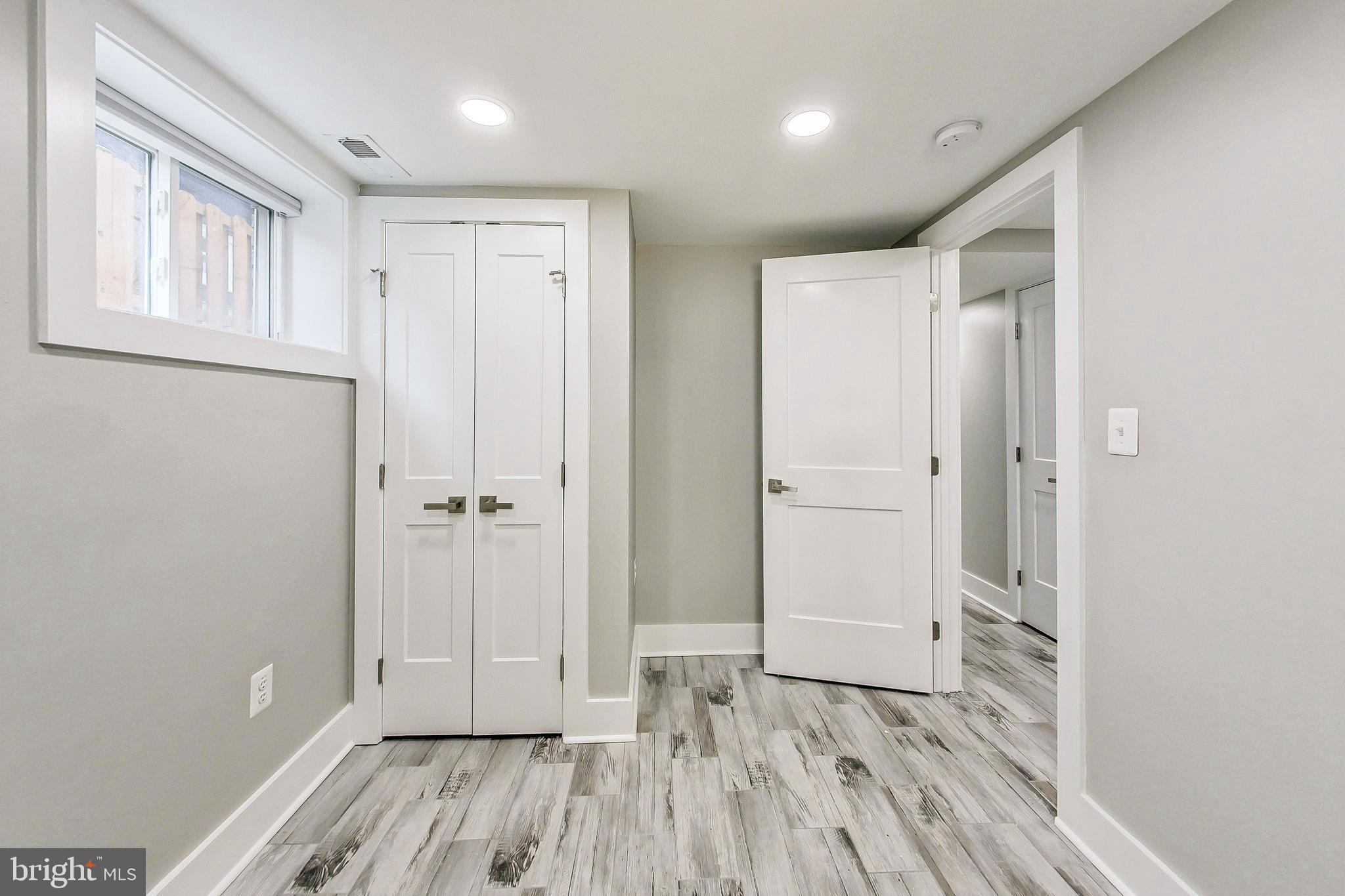 1124 Owen Place Northeast Washington, DC 20002 - Photo 16 of 19 a view of hallway with wooden floor