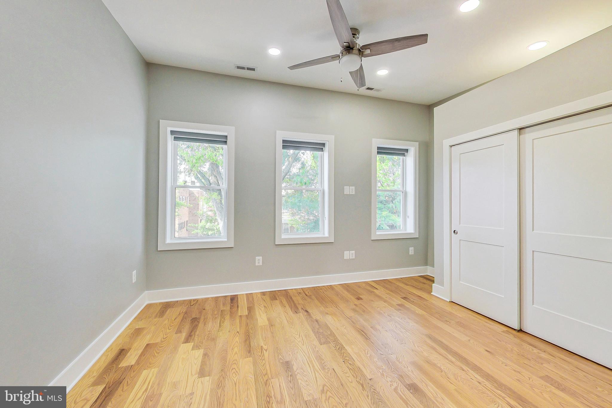 1124 Owen Place Northeast Washington, DC 20002 - Photo 8 of 19 a view of empty room with wooden floor and fan