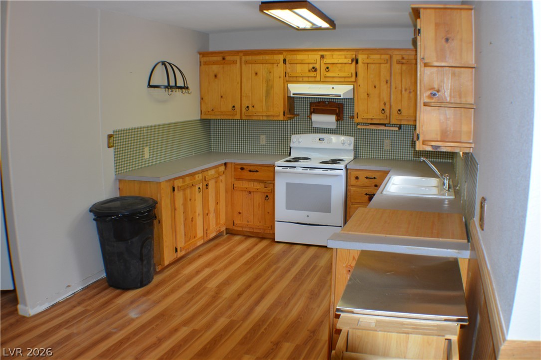 1321 Trout Canyon Road Las Vegas, NV 89124 - Photo 16 of 50 Functional kitchen with ample cabinetry and a bright, easy-to-maintain flooring.