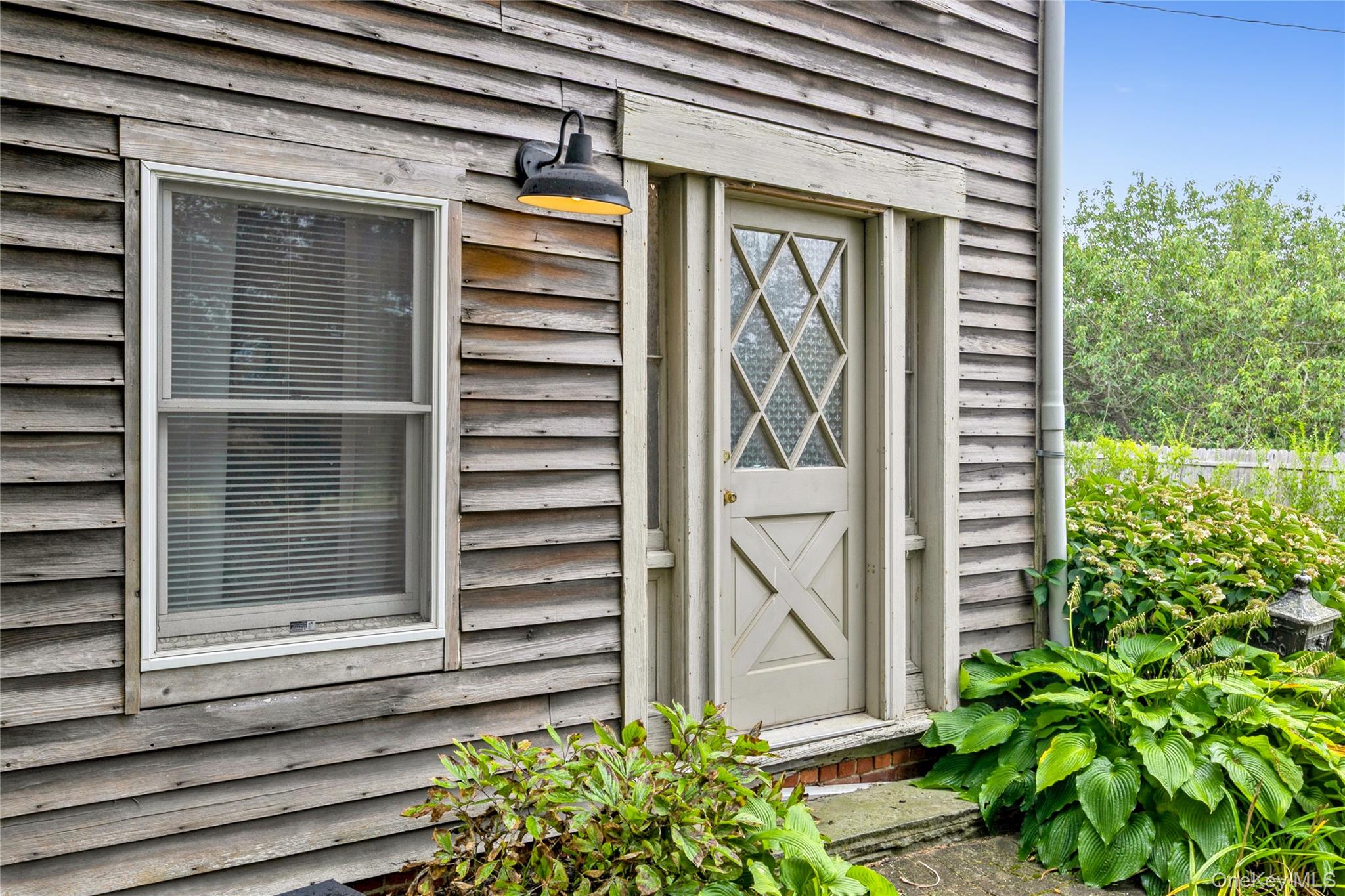 35950 Main Road Cutchogue, NY 11935 - Photo 11 of 39 a view of a door of the house