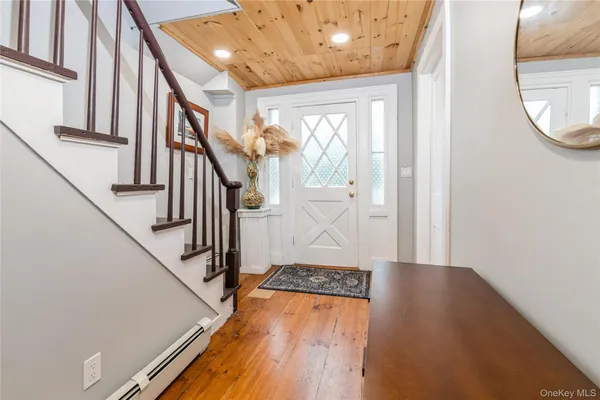 a view of entryway with wooden floor