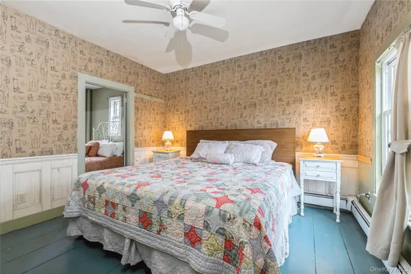 a bedroom with a bed and window