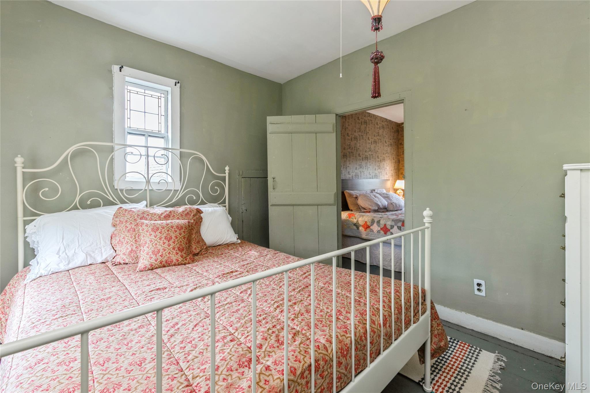 35950 Main Road Cutchogue, NY 11935 - Photo 24 of 39 a bedroom with a bed and a window