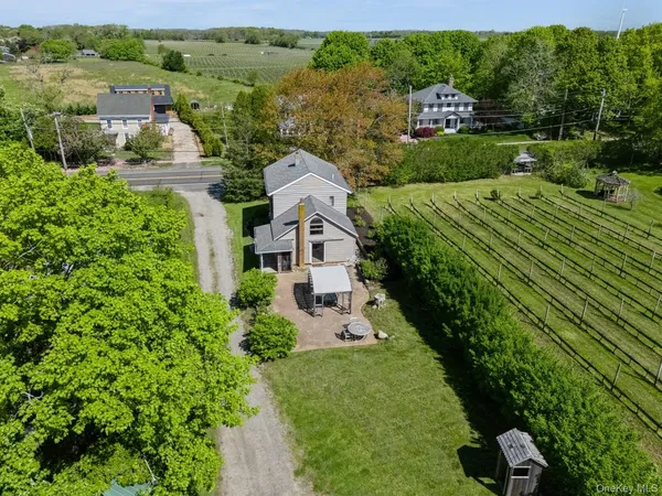 an aerial view of a house with yard