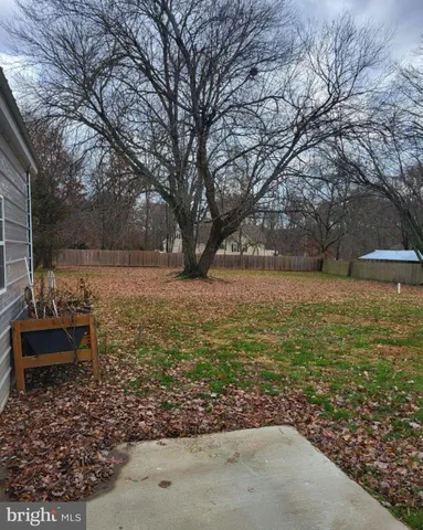 a view of a yard with an outdoor space