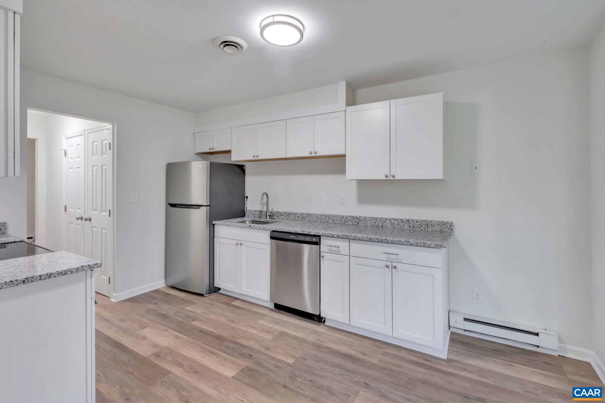 606 Bailey Road Charlottesville, VA 22903 - Photo 14 of 29 a kitchen with a sink a refrigerator and a stove