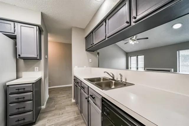 a kitchen that has a sink and a stove
