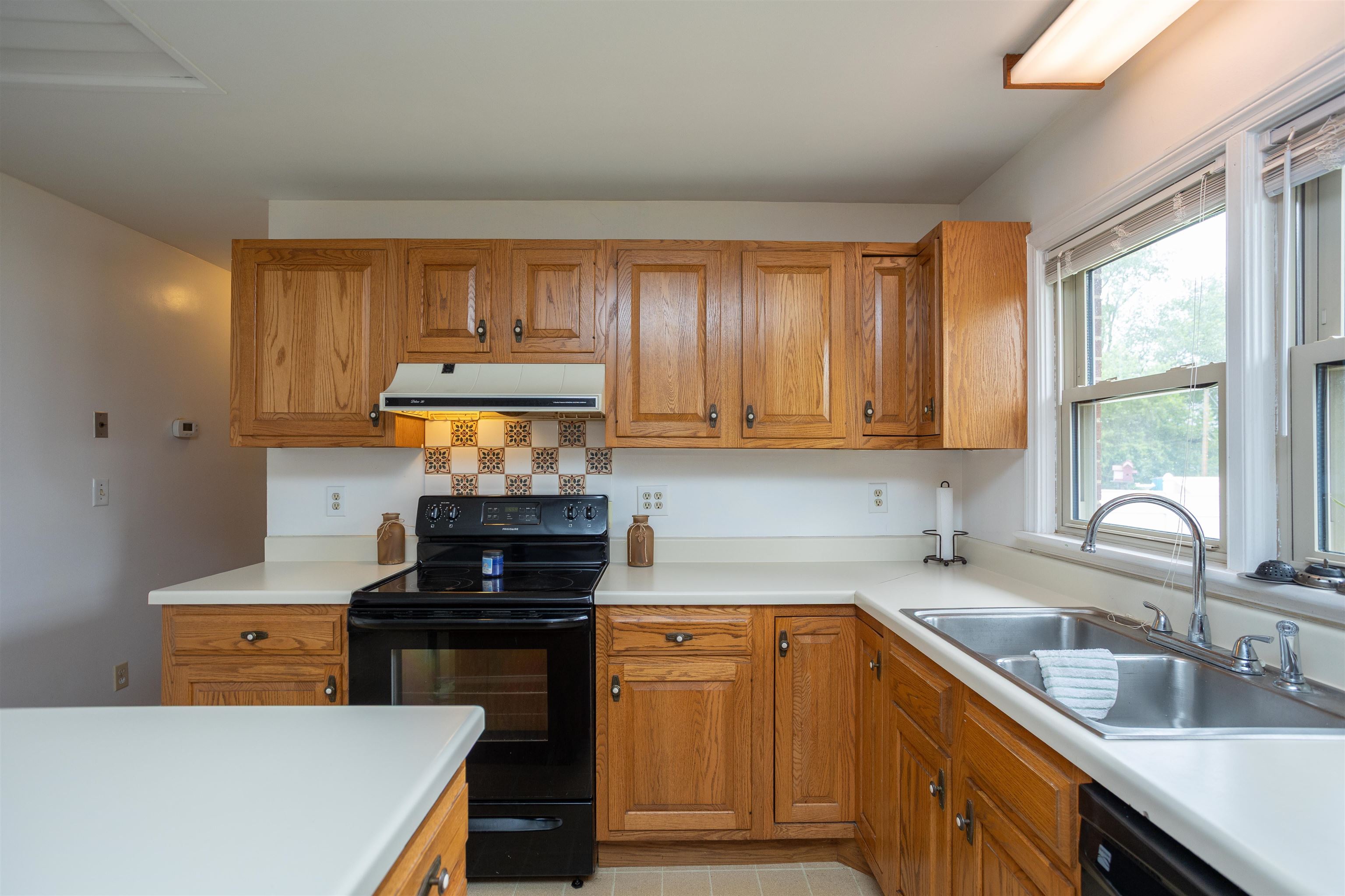 211 George Street Staunton, VA 24401 - Photo 12 of 37 a kitchen with a sink stove top oven and cabinets