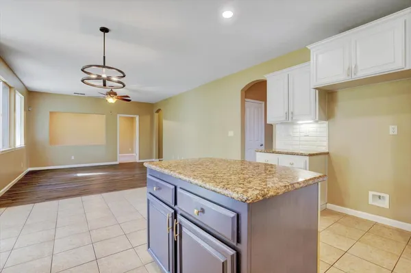 a view of an empty room with a fireplace