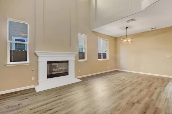 a view of an entryway with wooden floor
