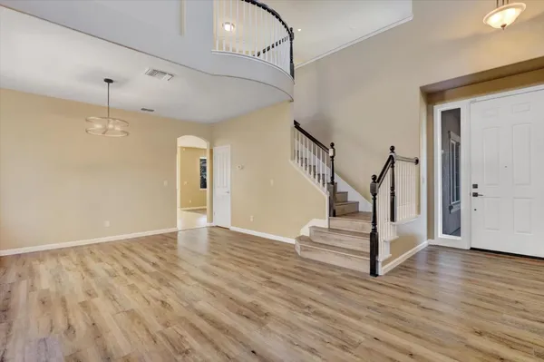 a kitchen with kitchen island granite countertop a stove sink and microwave